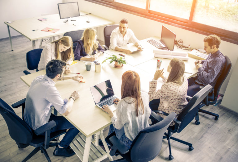 Meeting of young business people in a modern office - Start up company, workers brainstorming